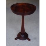 A William IV figured mahogany circular Occasional Table on a panel sided baluster column and