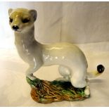 A Beswick Model of a stoat in white winter coat, No. 1021, withdrawn 1963 (a/f).