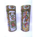 A pair of late 19th Century Cantonese cylindrical Vases decorated with panels of birds, flowers