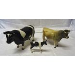 A Beswick Model of a Friesian calf No. 1249C, a Friesian bull No.1439A (horn chipped) and a Jersey