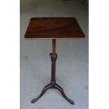 An early 19th Century mahogany oblong top Reading Table with an adjustable column and on triple