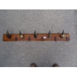 A number of horn Coat Hooks on an oak board. 3' 8" (112cms) wide.