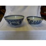 A 19th Century Chinese blue and white bowl with panels of urns, tables etc with in a prunus