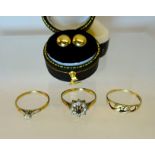 A 9ct. gold Ring with a small diamond, two other gold rings and a pair of earrings.