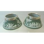 A pair of Wedgwood green Jasperware circular Salts and with silver rims. London 1914.