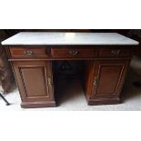 An Edwardian mahogany Washstand with white marble top, the base with three frieze drawers above a