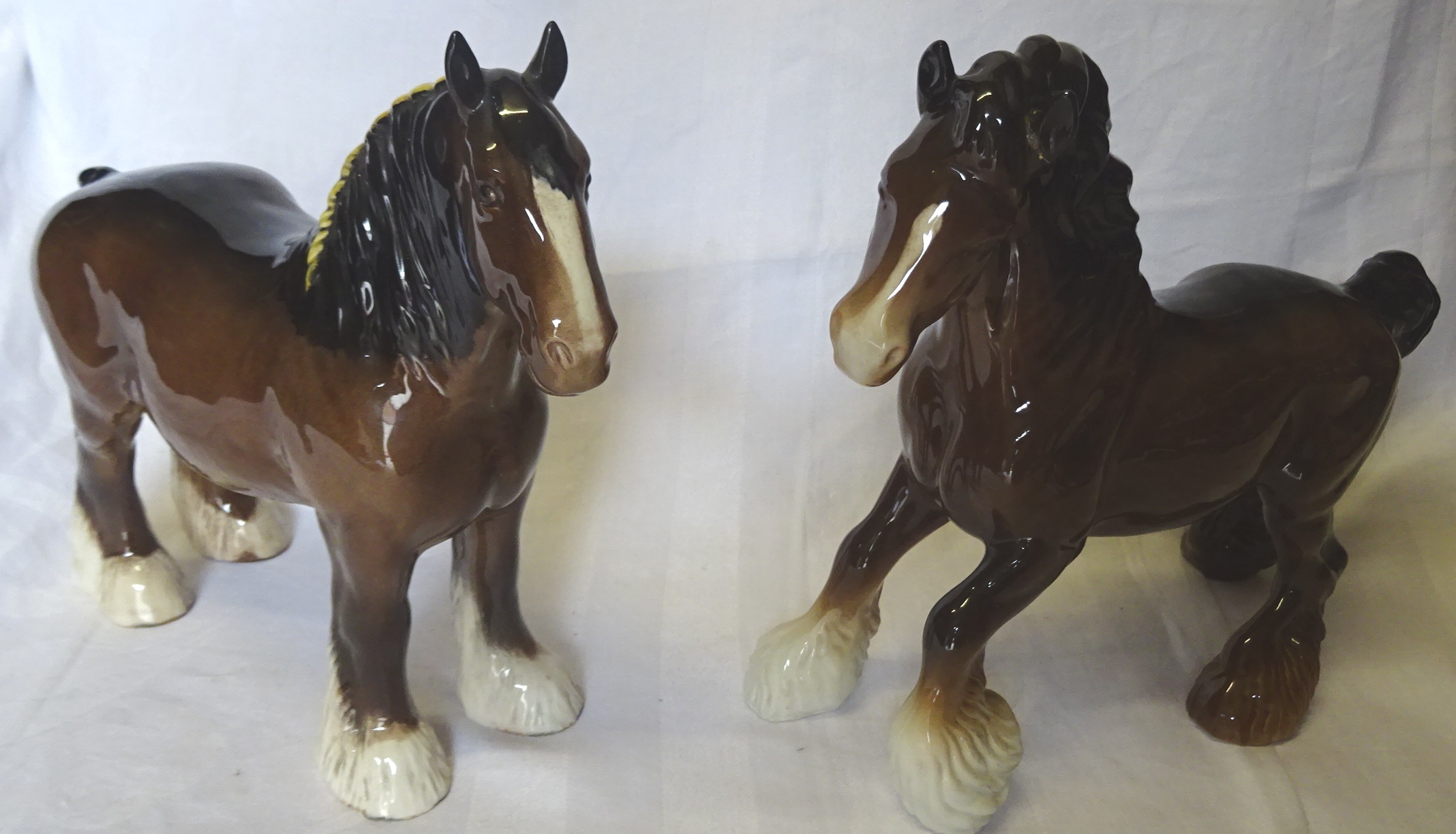 A Beswick Model of a cantering shire horse in brown gloss, no. 975, and a Beswick shire mare in