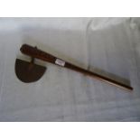 An African Axe with wooden haft and half moon blade. 19" (48cms) long.