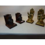 A pair of oak Book Ends mounted with spelter busts of Shakespeare and a pair of "Praying Hands"