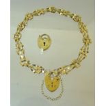 A 9ct. gold gate link Bracelet with padlock clasp and a gold padlock. (3.8gms)