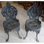 A set of four painted cast iron Garden Chairs with splay supports.