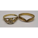 A 9ct gold Dress Ring set with a solitaire diamond in an illusion setting and 9ct gold Wishbone