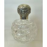 A small cut glass globe Scent Flask with embossed silver cover, London, 1897, maker Mappin & Webb.