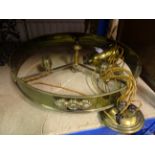 A brass circular three branch rise and fall Light Fitting with frosted glass shades, 19" (48cms)