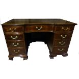 A Georgian design mahogany Pedestal Desk with tooled leather top and concave fronted frieze