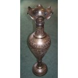 A large Indian brass baluster Vase with crimped rim and engraved decoration on a domed circular