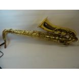 A Stagg brass Tenor Saxophone, cased.