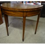 A 19th century mahogany semi-circular Tea Table with cross banded border, fold-over top and square