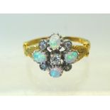 A silver gilt cluster Ring set with opals.