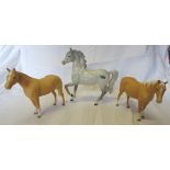 A Beswick prancing Arab type horse No. 1261 in grey gloss, first version and two other Beswick