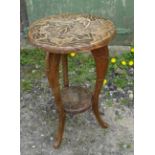 A Japanese two tier circular Occasional Table carved with flowers and leaves. 17" (43cms) diameter.