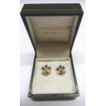 A pair of gold spray Earrings each set with sapphires and diamonds.