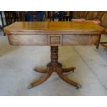 An early 19th Century mahogany Tea Table with fold over 'D' shape top, knulled column and quartet