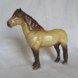 A Beswick Model of a Highland pony, No. 1644 in gloss finish.