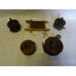 A wooden Fishing Reel. 4" (10cms) and four others.