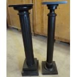 An ebonised fluted Pedestal on a stepped square base and another similar.