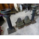 A pair of painted cast iron Pedestals on stepped square bases and a pair of cast iron pillar