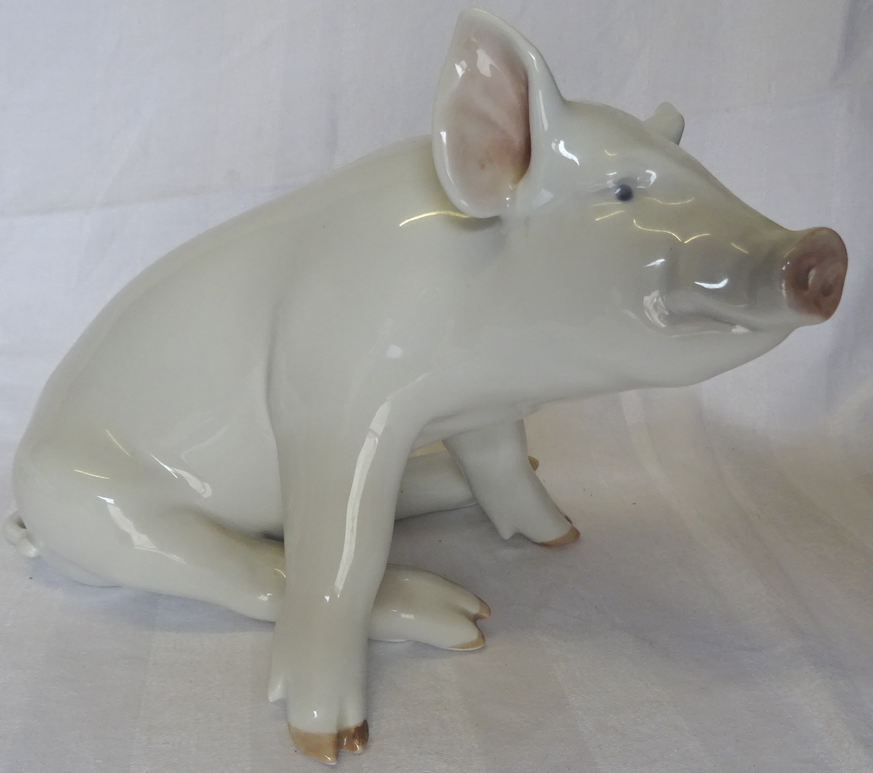 A Royal Copenhagen Figure of a white pig. 6 1/2" (16cms) high.