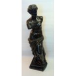 After The Antique; a bronze figure of the Venus De Milo on a veined marble base. 20" (51cms) high.