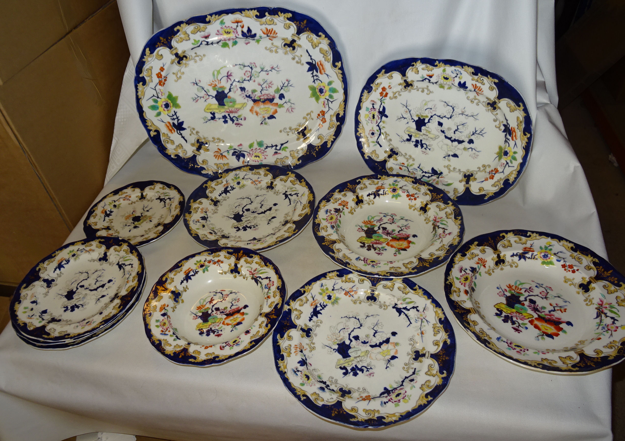 An early Victorian Minton and Boyle part Dinner Service decorated with Japanese flowers within a