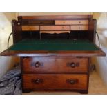 A 19th Century mahogany two part Campaign Secretaire Chest with fall front writing drawer, the