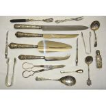 A silver handled Pastry Slice, a silver handled cheese knife, two other silver handled knives and