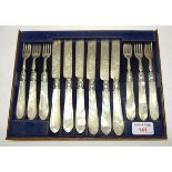 A set of six Victorian Dessert Knives and Forks with engraved silver blade and mother of pearl