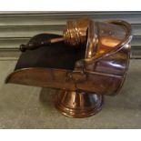 A Victorian copper Coal Scuttle with swing handle together with a copper scoop with turned wooden