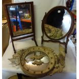 An oval swing Toilet Mirror in mahogany frame with chequer banded decoration and skeletal stand, one