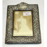 An Edwardian upright silver Table Photograph Frame with embossed floral decoration, Birmingham,