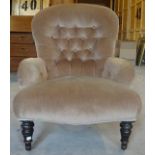 A Victorian tub shape Armchair with button upholstered back and seat on short turned supports.