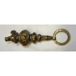 An Edwardian silver gilt Baby's Rattle with mother of pearl teething ring, Birmingham, 1906.