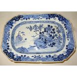 A Chinese export oblong Plate decorated in blue and white. 11 1/2" (29cms) wide (chipped).