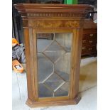 A 19th Century mahogany Corner Cupboard with stepped and dentil cornice, enclosed by a single glazed