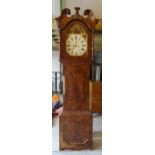 A 19th Century Longcase Clock the arched dial painted with a figure and flowers, with eight day