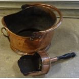 A copper Coal Bucket with swing handle and a scoop with turned wooden handle.