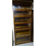 A Globe Wernicke oak six tier sectional Bookcase enclosed by glazed up and over doors. 2' 9 1/2" (