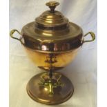 A Victorian copper two handled Tea Urn with brass tap and circular foot.
