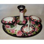 A George Jones Crescent China Dressing Table Set decorated with roses comprising; oval tray, two