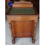 An Edwardian walnut Davenport with hinged stationery compartment and tooled leather writing slope